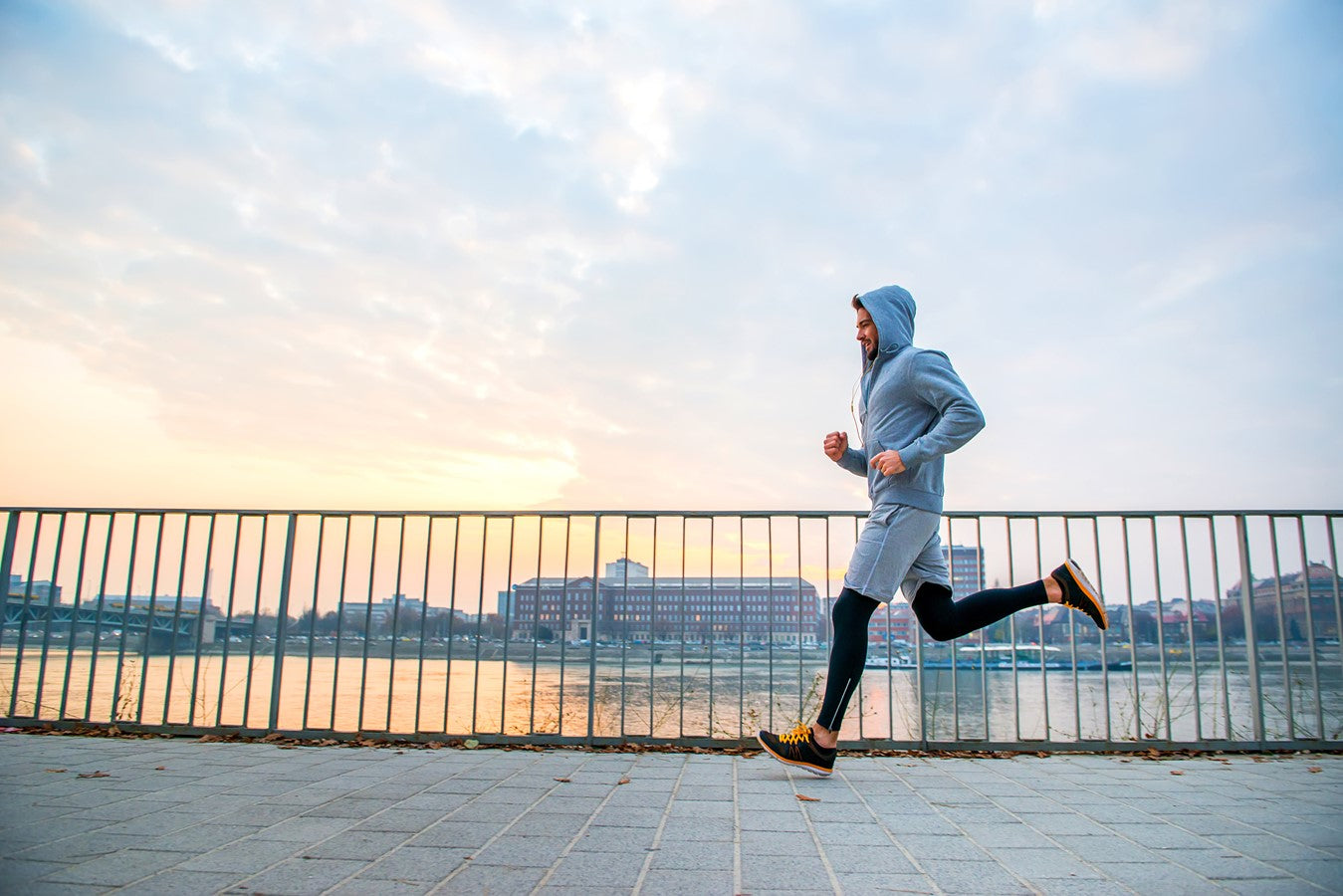 man running with water in background
