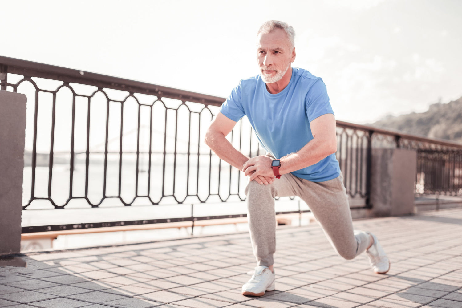 man stretching on balcony