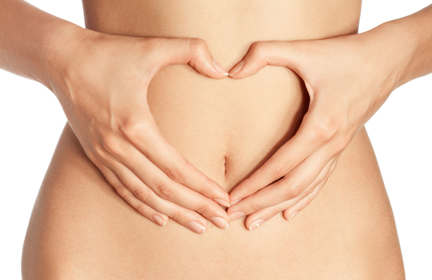 woman making a hand heart over stomach