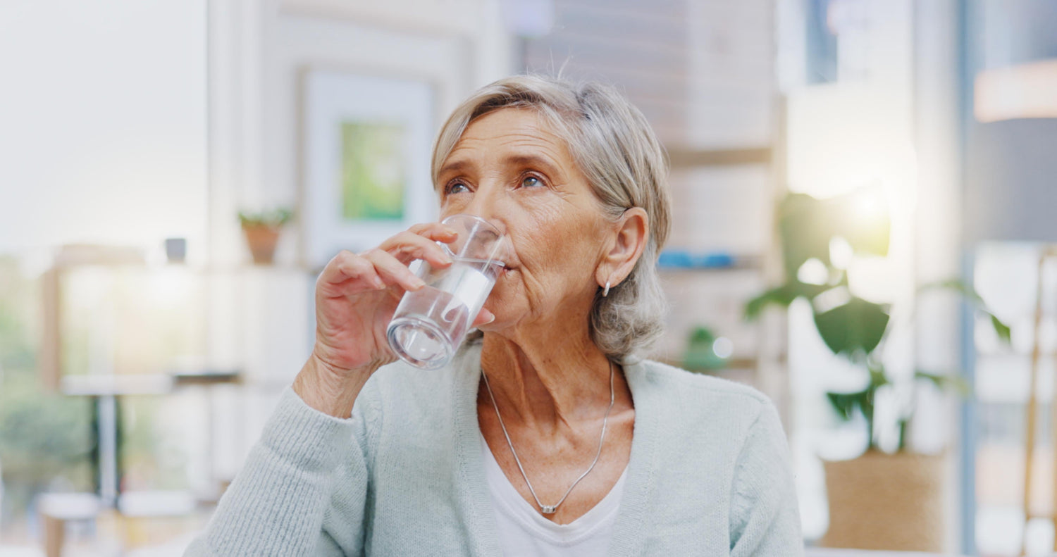 healthy old woman drinking water