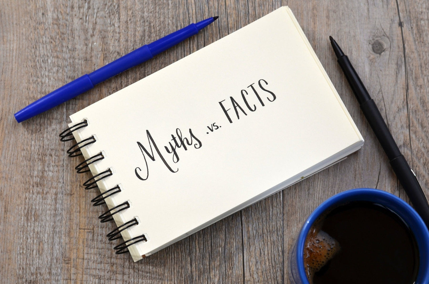 myths versus facts written on notepad