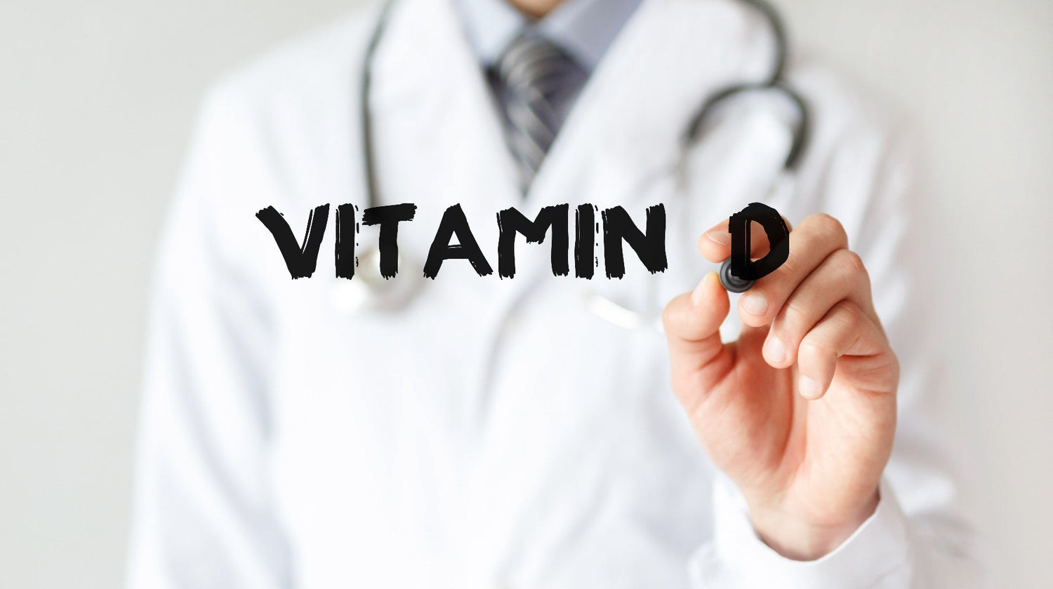 doctor writing vitamin D