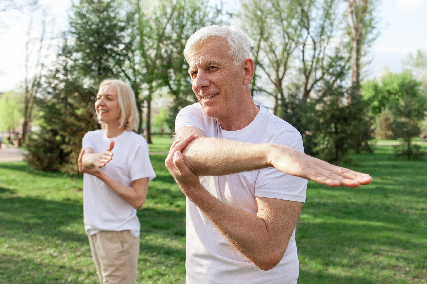 elderly couple stretching