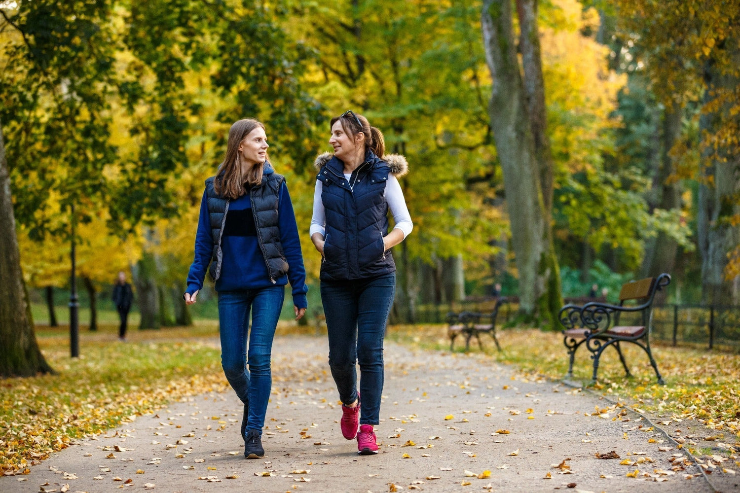 two women walking at the park