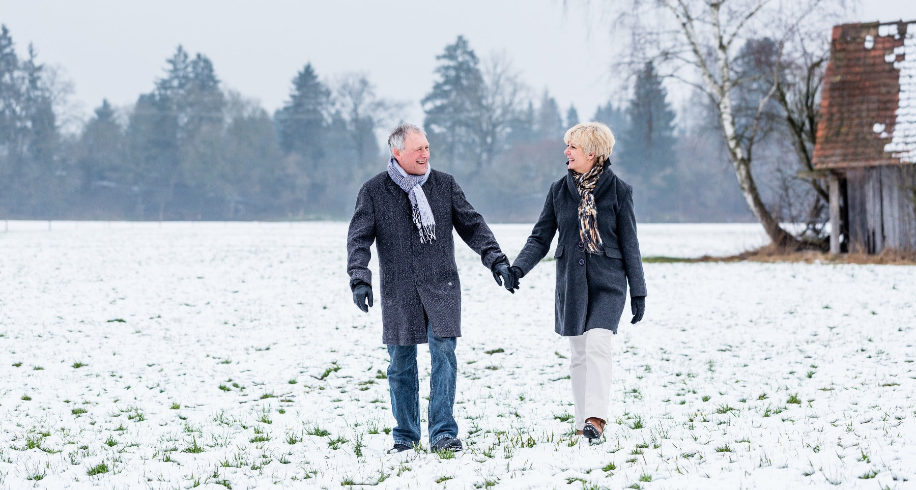 elderly couple walking during winter