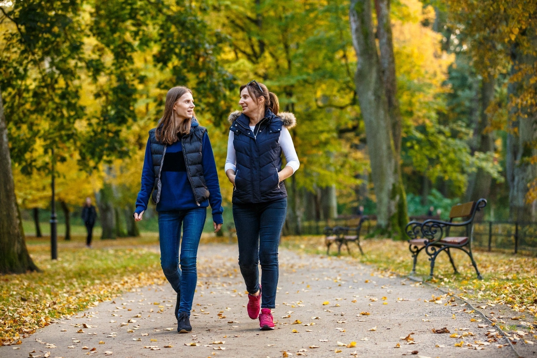 two women walking at the park